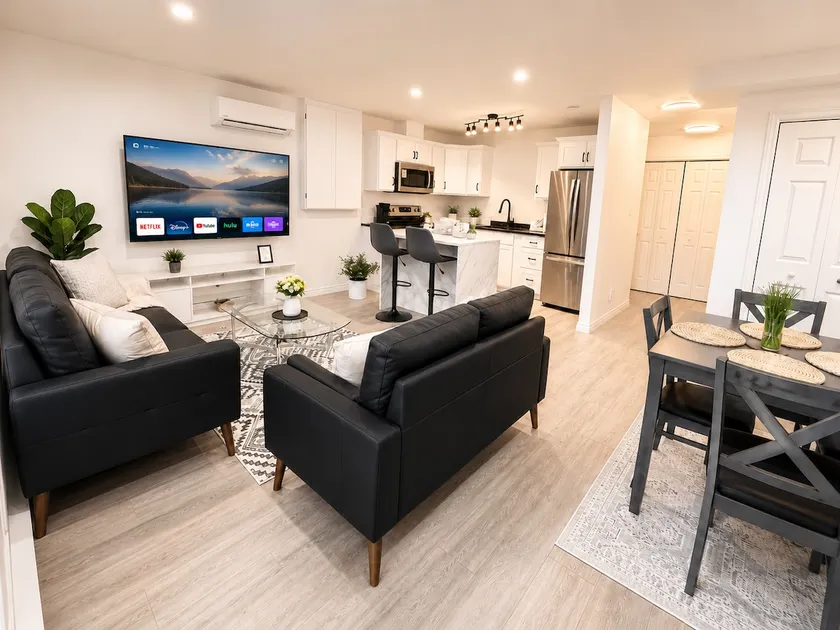 Modern 2BR Suite Parking Laundry - Image 1