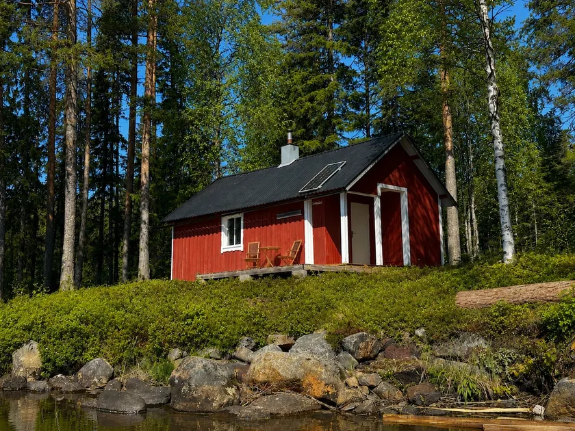 Secluded lake house with a private jetty and a boat - Image 1