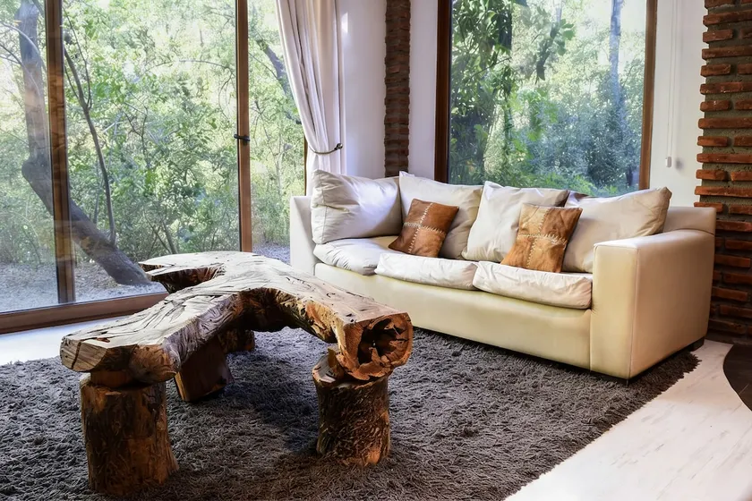 Stone house in the native forest · by the river - Image 1