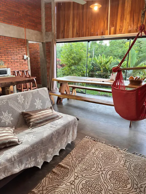 A refuge in the countryside, surrounded by a colorful garden. - Image 1