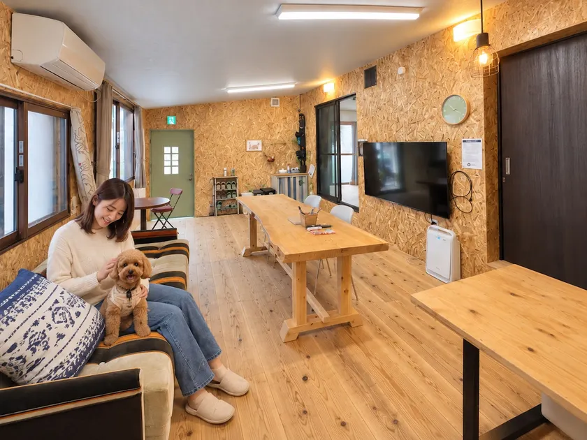 This is a unique space with a spacious living room with a large monitor and two bedrooms with bunk beds. - Image 1
