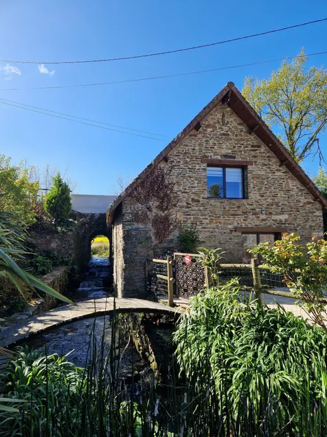 Old mill by a stream - Image 1