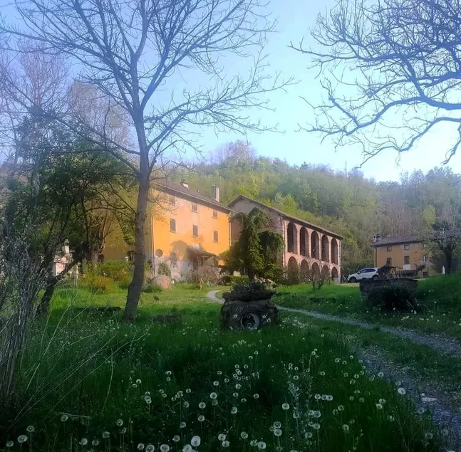 Historic 18th-century farmhouse surrounded by nature - Image 1