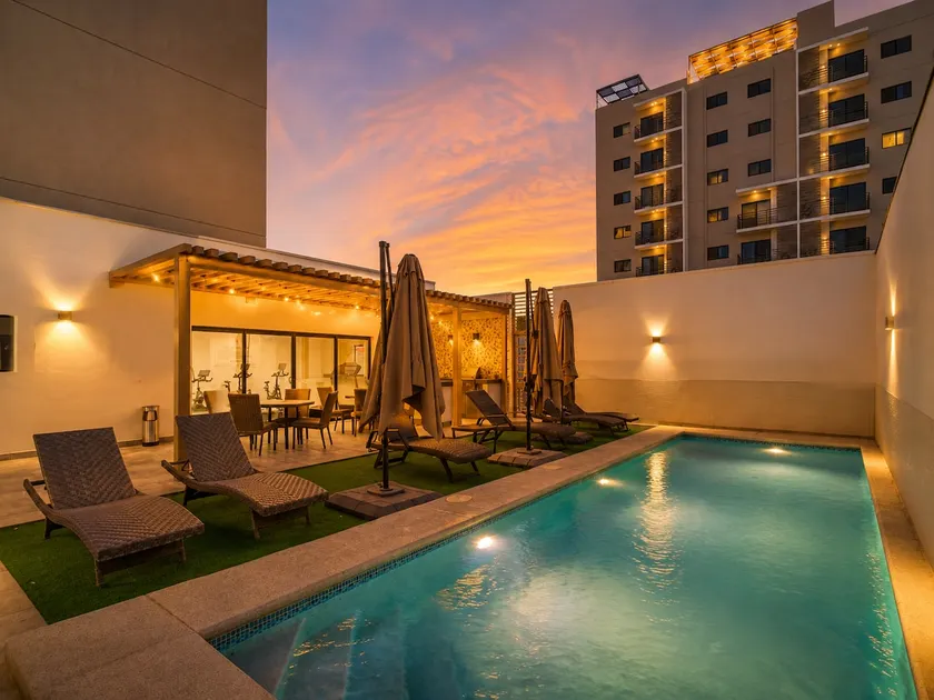 Central 2BR Tower | Pool, Gym & 2 Parking Spaces - Image 1