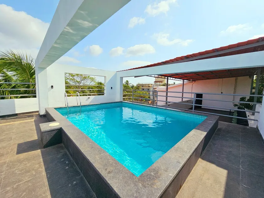 Serene 2BHK Porvorim Apartment with Forest View & Pool Access - Image 1