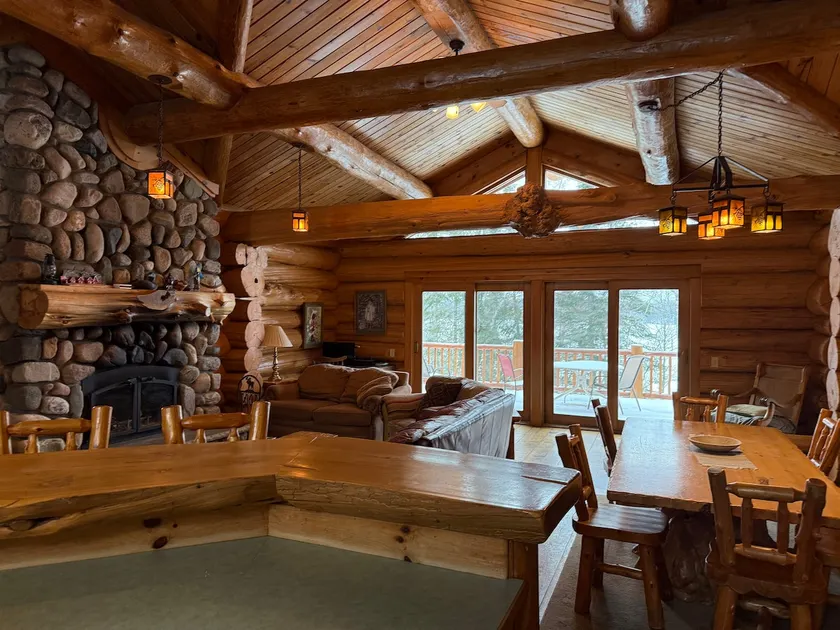 Log lodge in crystal clear lake in the Chippewa. - Image 1