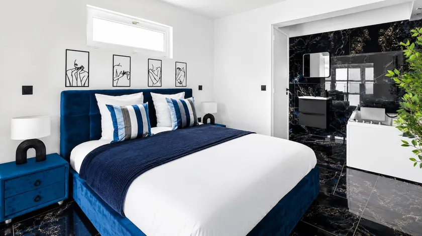 Elegant Jacuzzi Suite • Black & Blue Decor • Sleeps 2 - Image 1