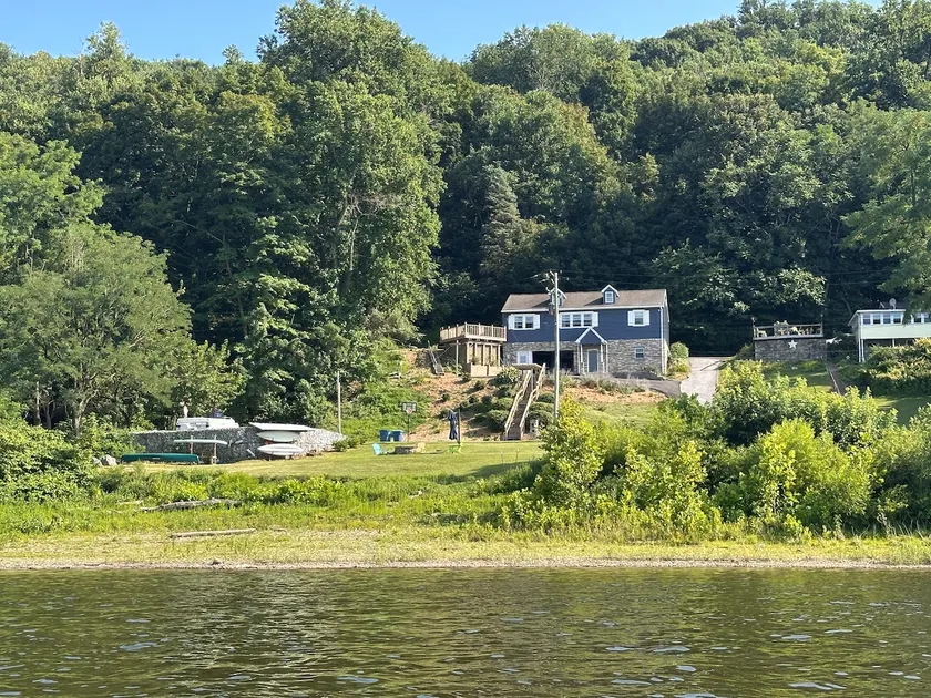 River Lodge: Cozy Waterfront Home Nestled in Woods - Image 1