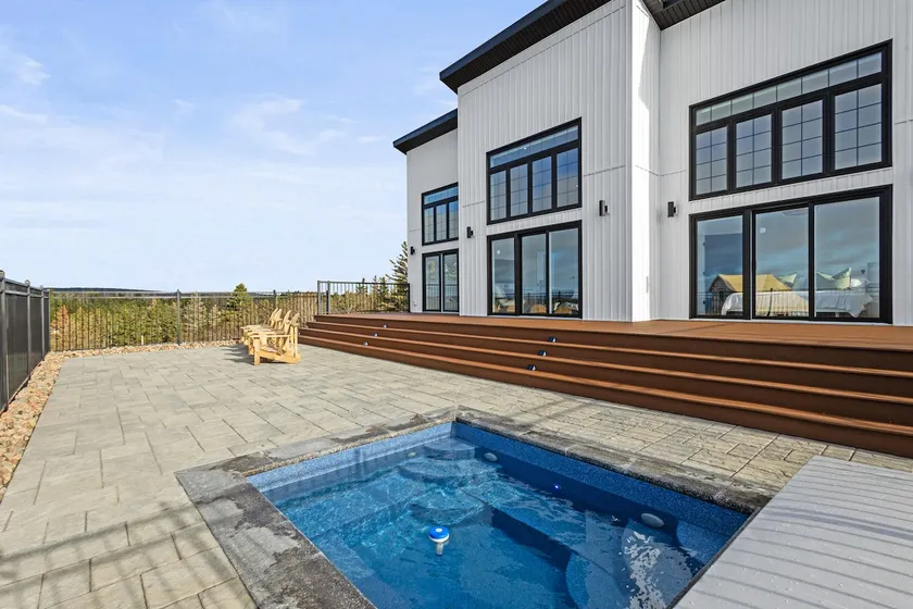 In ground HOT TUB + 2 primary bedrooms w/ ensuites - Image 1