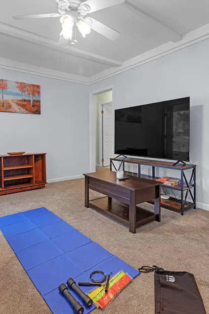 Near MSU • Elevated Deck • 65” TV • Pets. Book Now - Image 1