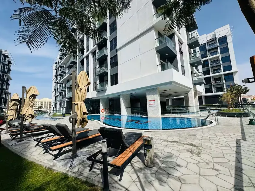 Vogue Vacation Homes, Dubai International City Olivz by Danube near Dragon Mart, One Bedroom Apartment with Balcony and City View, Access to all Amenities - Image 1