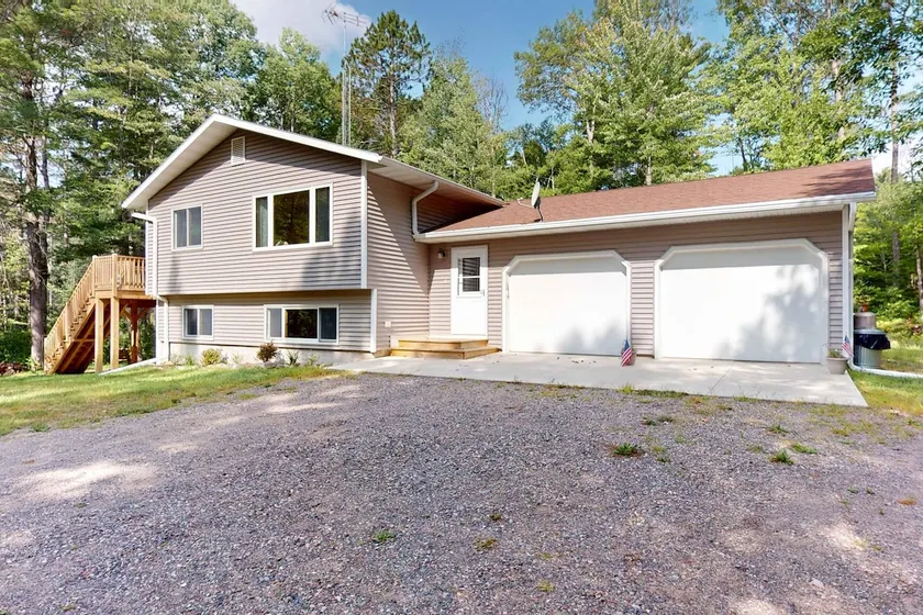 Cozy Tree-Lined Home Near Lakes & Trails - Image 1