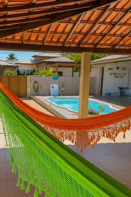 House in a gated community with a pool and air conditioning in the bedrooms, ideal for families. - Image 1
