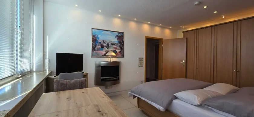 Bright room with private bathroom and market square view - Image 1