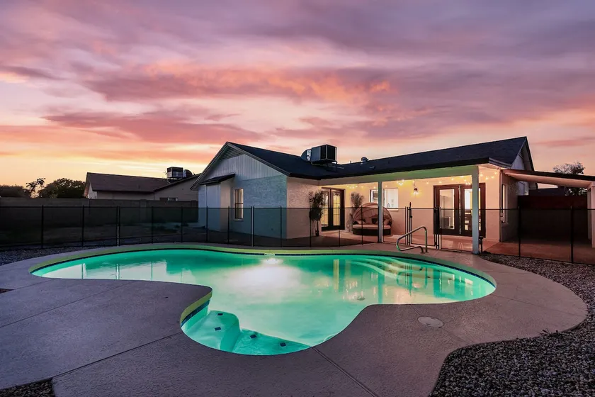 An oasis featuring a pool, where quiet luxury meets backyard tranquility. - Image 1
