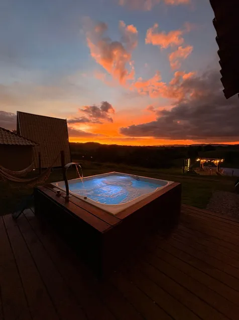 A chalet, spa, and swimming pool. - Image 1