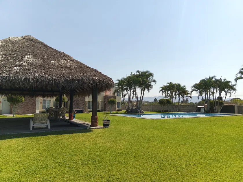 House in a residential development with a pool - Image 1