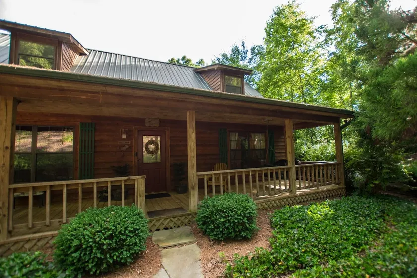 Hunker Down by the Creekbank in this Cozy Private - Image 1