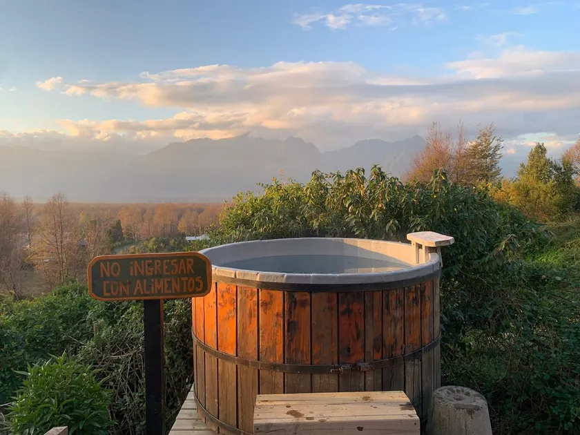 Tiny with a tinaja (traditional wooden soaking tub) in Pucón - Image 1