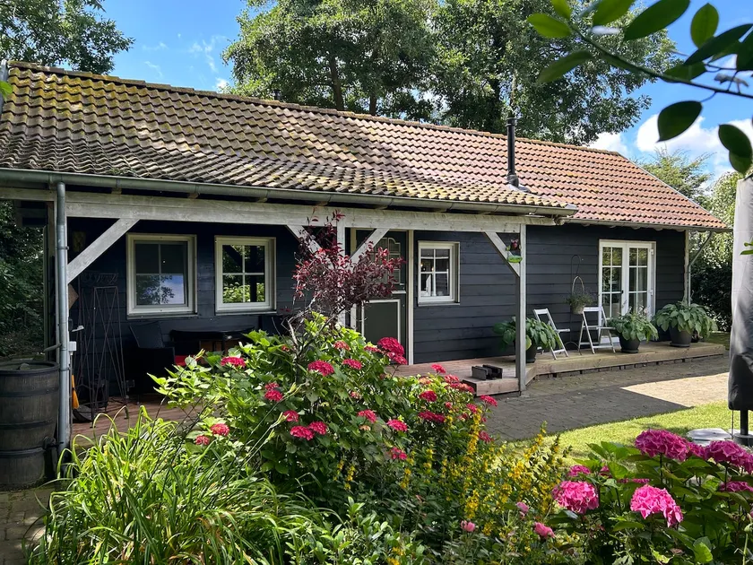 Nature house in a harbor town on a small park - Image 1