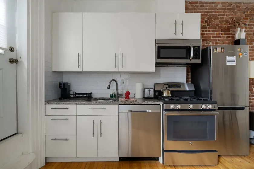 Central 1BR w Balcony & Laundry, Walk to PATH NYC - Image 1