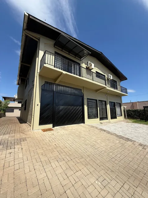 House with 2 en-suite bedrooms and 1 bedroom, half bath, and 2 regular parking spaces - Image 1