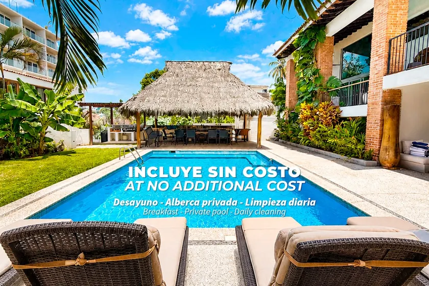 Steps from the beach, pool, games room and privacy! - Image 1