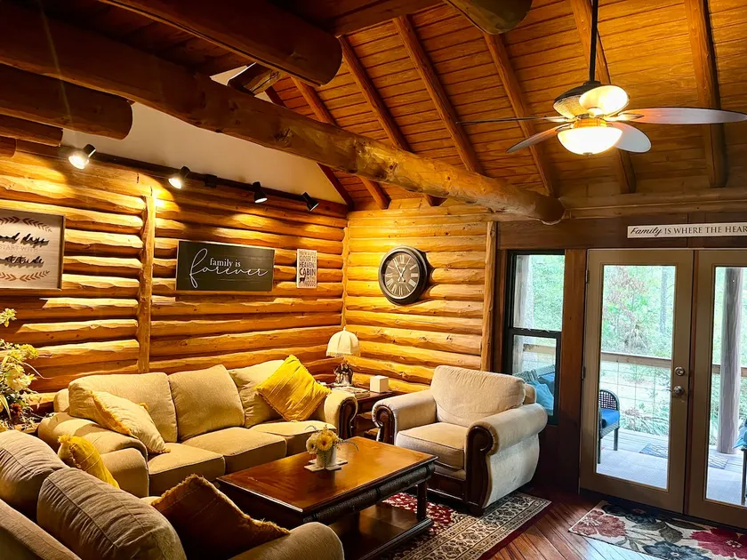 A charming cedar log cabin tucked in the woods. - Image 1