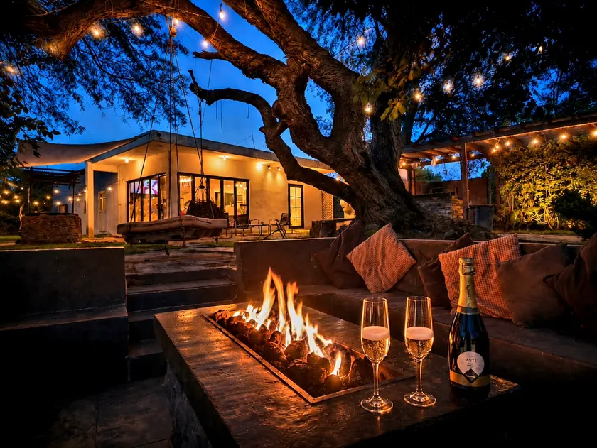 Casa T'ähi · Under the big tree, firepit and pergola - Image 1
