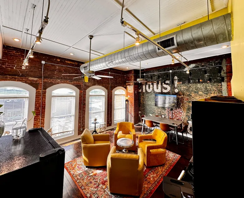 Stylish Boutique Loft, Vintage Coca-Cola Mural - Image 1