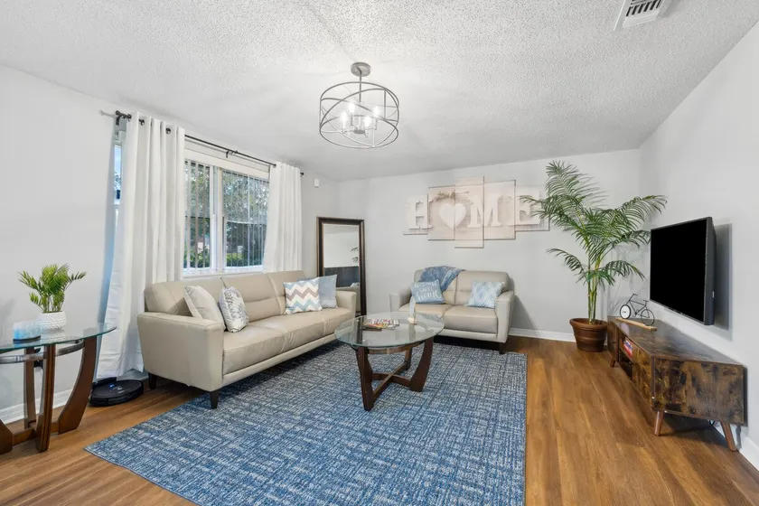 Cozy 3BR Gem near JAX Airport | Huge Yard | Lanai - Image 1