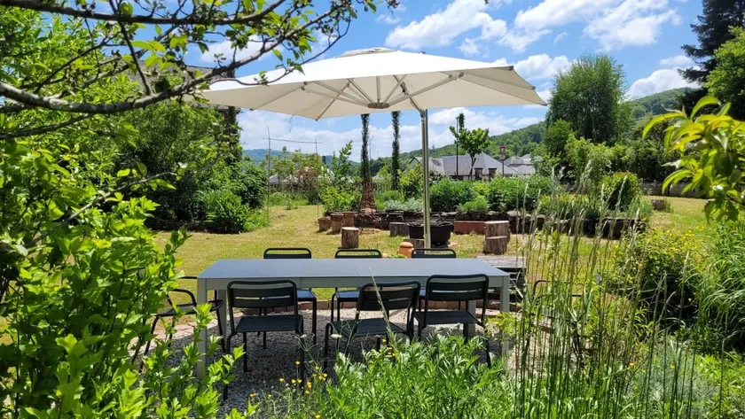 A family home with a landscaped garden - Image 1