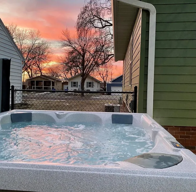 The Lounge: Hot Tub • 86” TV • Golf • Fenced Yard - Image 1