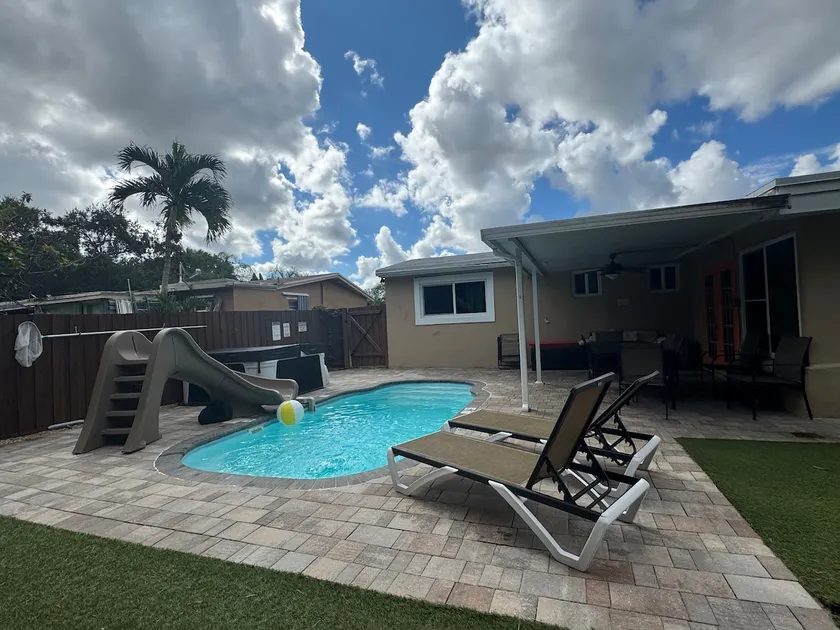 FUN backyard - Playground, Heated Pool, & Jacuzzi! - Image 1