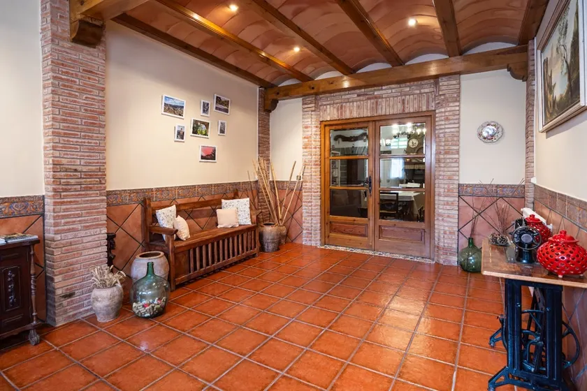 A townhouse with a picnic area and fireplace. - Image 1