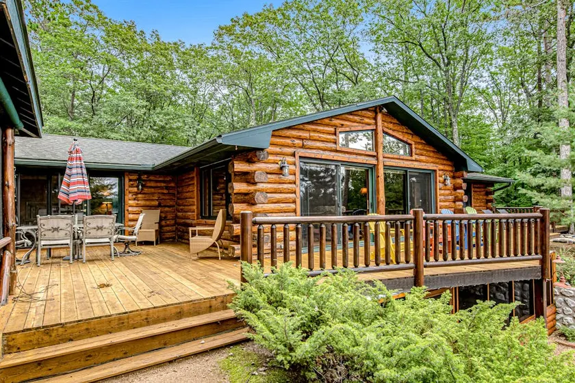 Lakefront Log Cabin with Sunset Views and Dock - Image 1
