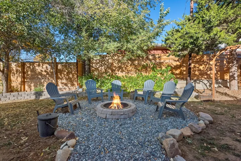Centrally Located Suite with Firepit & Backyard - Image 1