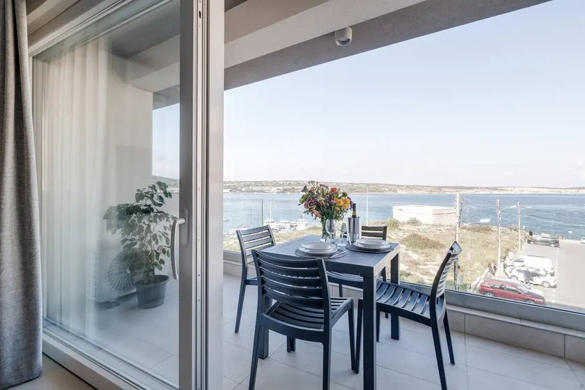 9TEN11 FL3 1BED Seafront Mellieha Bay by Homely - Image 1