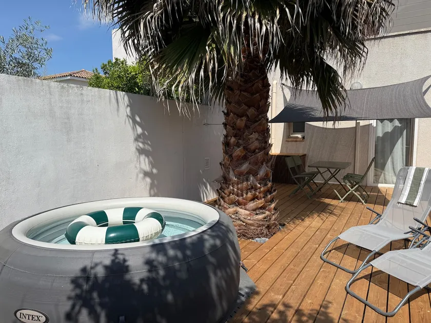 Palmae | Small loft with garden terrace and spa - Image 1