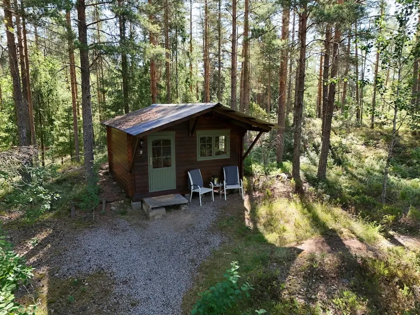 Nice cabin in the woods near water with canoe - Image 1