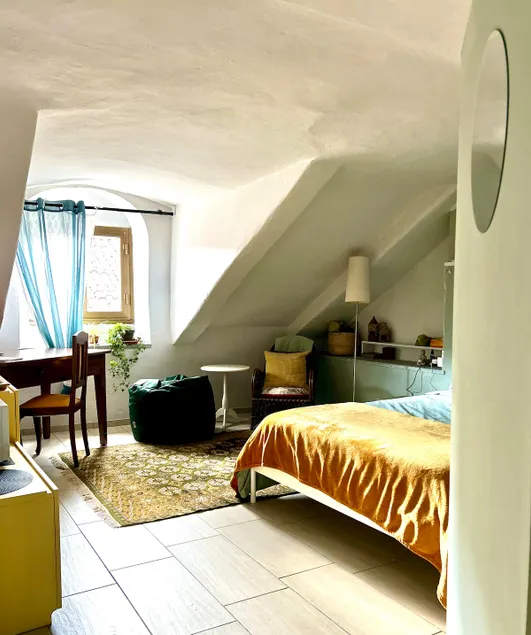 The attic | room with bathroom in the historic center - Image 1