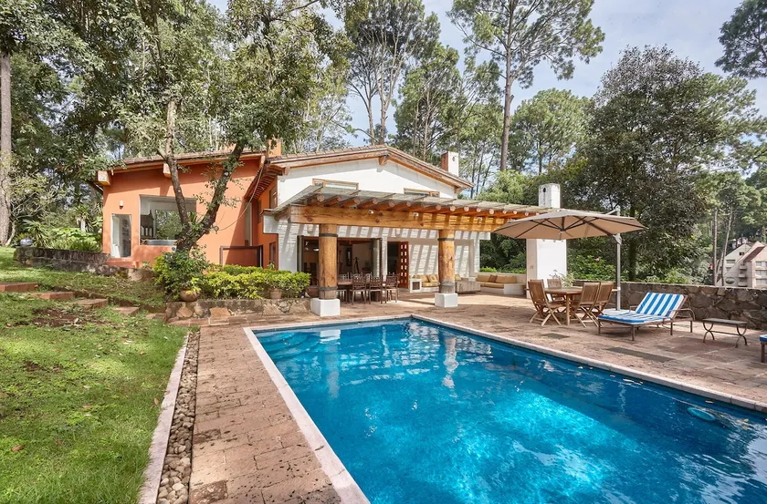 Residence with a swimming pool, paddle tennis court, and garden. - Image 1