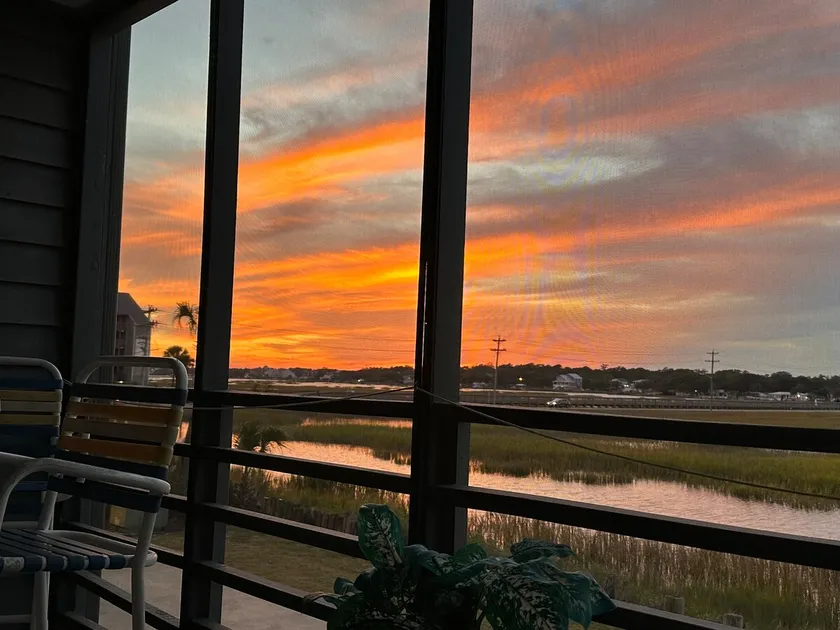 Location! -Peaceful Marsh-view w/ Screened Balcony - Image 1