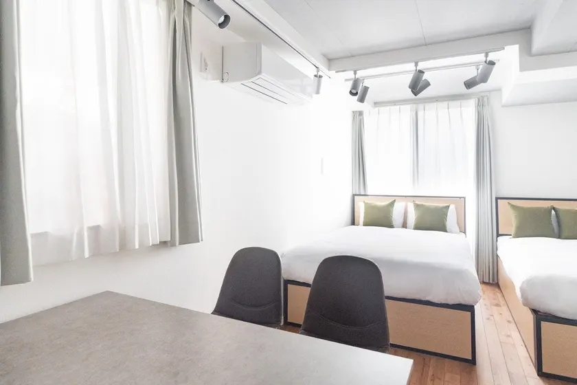 Sumyca Tokyo's Apartment 1, Apartment with a double bed and a single bed. - Image 1