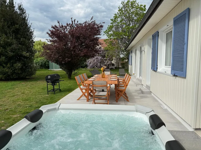 Contemporary house with a hot tub and garden - Image 1