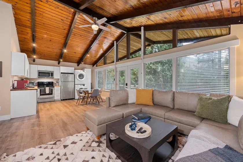 Forest Retreat with Two Kings and Expansive Deck - Image 1