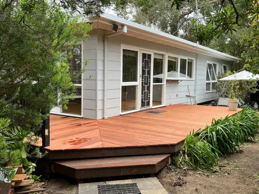 Secluded beach cottage surrounded by trees - Image 1