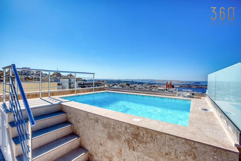 Feel at Home in Mellieha with Rooftop Pool & Views - Image 1