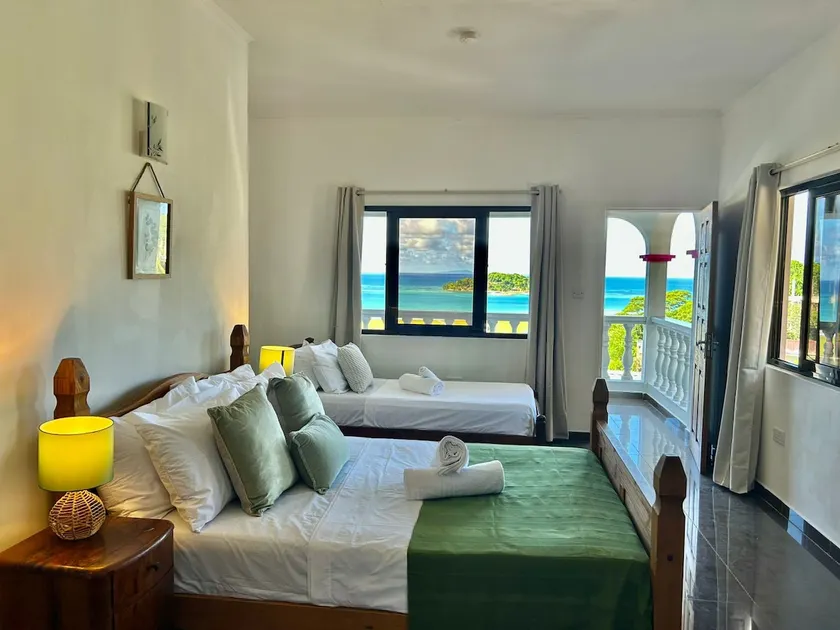 Villea Frangipani 2BR Top Floor Apt Near Airport - Image 1