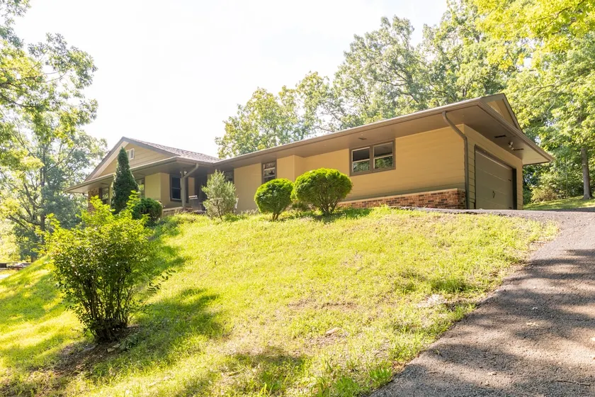 Home on the hill, nestled in the woods. - Image 1